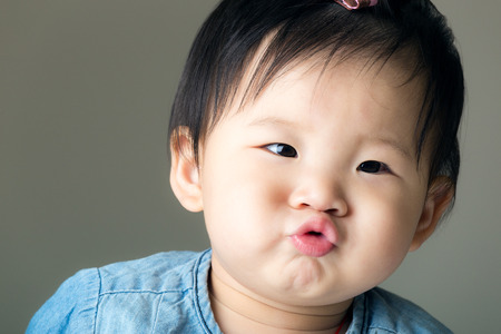 Asian baby girl purse lipの写真素材