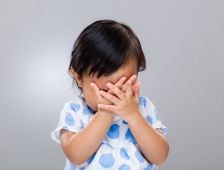 Upset baby girlの写真素材