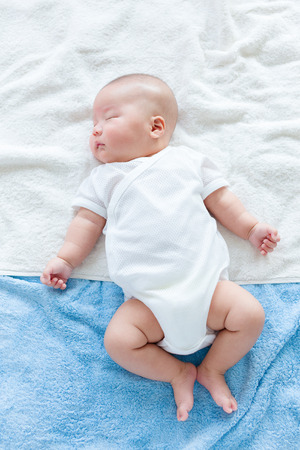 Sleeping asian newborn babyの写真素材
