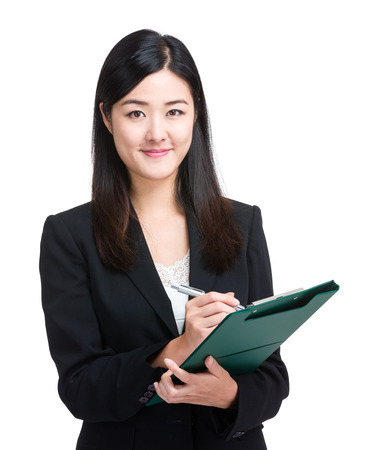 Business woman write on clipboardの写真素材