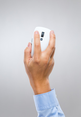 Businessman hand holding computer mouseの写真素材