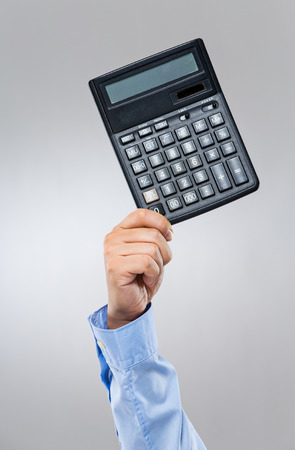 Businessman hold with calculatorの写真素材