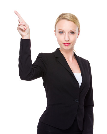 Businesswoman with finger point upの写真素材