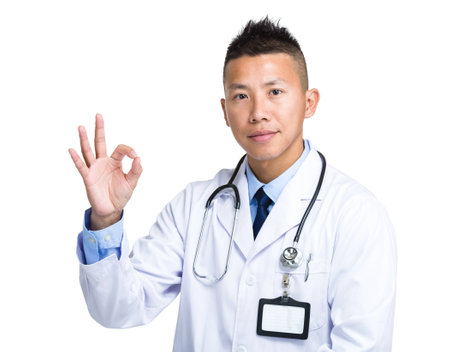 Asian medical doctor with ok signの写真素材