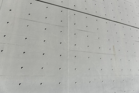 Concrete wall with holesの写真素材
