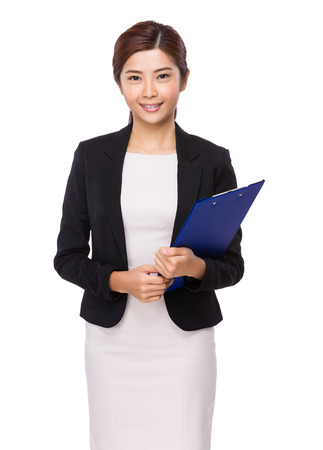 Businesswoman with clipboardの写真素材