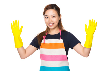 Housewife with plastic gloves and showing outの写真素材