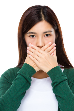 Woman with hand cover her mouthの写真素材