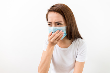 Asian woman want to vomit and wear with maskの写真素材