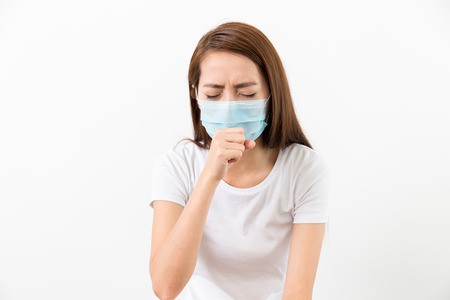Asian woman cough with maskの写真素材