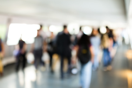 Blur bokeh of footbridge with crowded pedestrian