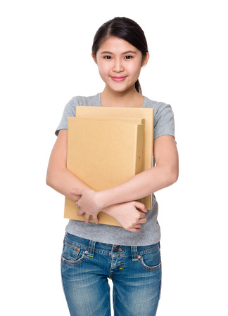 Asian young woman holding with folderの写真素材