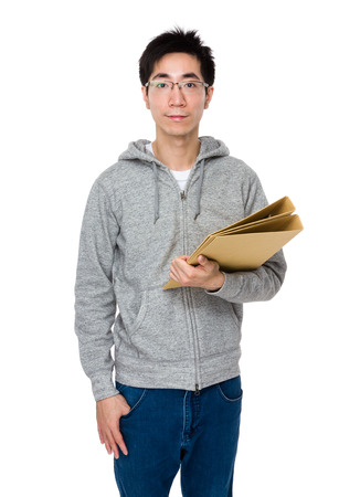 Young businessman holding with folderの写真素材