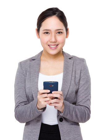 Young businesswoman use of cellphoneの写真素材
