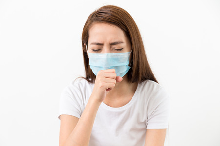 Asian woman cough with face mask protectiveの写真素材