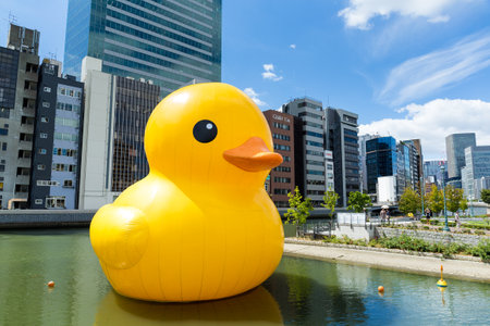 Osaka Japan - September 19 : Giant Rubber Duck floating outside Nakanoshima park on September 19 2015 in Osaka Japan. Created by Florentijn Hofman and it's playful presence revive the happiness of life's simple pleasuresのeditorial素材