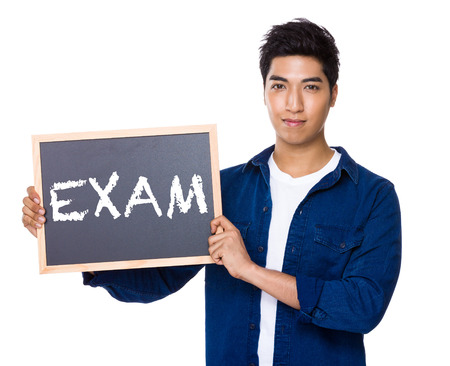 Asian mixed Indian man with blackboard showing a word examの写真素材