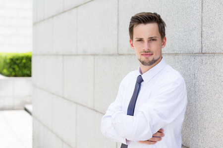 Caucasian businessman standing outsideの写真素材