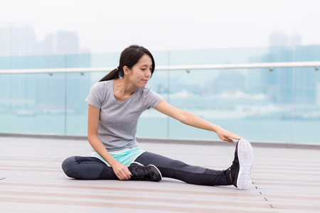 Young Woman do stretching at outdoorの写真素材