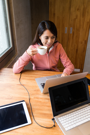 Woman use of the laptop computer at homeの写真素材