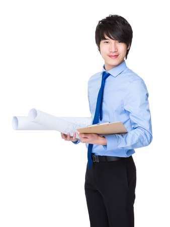 Young Engineer hold with blue print and clipboardの写真素材