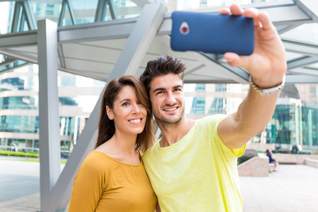 Young couple take selfie by smart phone