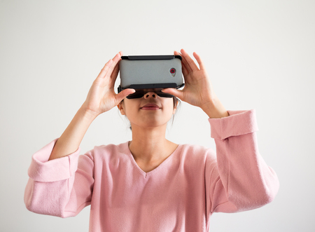 Woman watching though virtual reality device