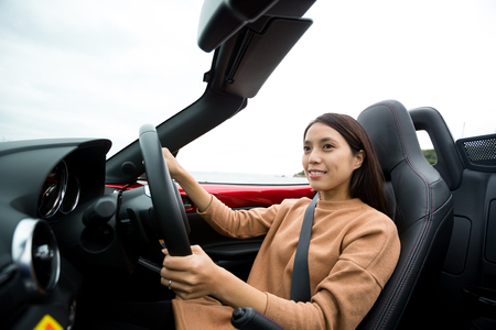 Happy Woman driving convertibleの写真素材