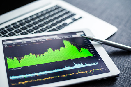 Stock market data analyzing on tablet pc Stock market data analyzing on tablet pc