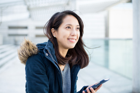 Young woman with her cellphoneの写真素材