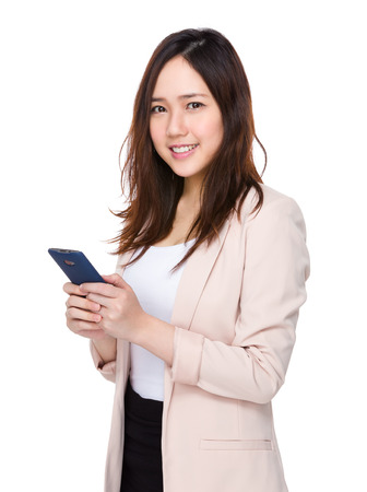 Asian young businesswoman use of the cellphoneの写真素材