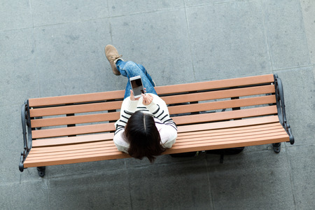 Top view of woman use of mobile phoneの写真素材