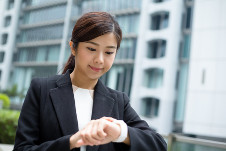 Businesswoman use of wearable smart watchの写真素材