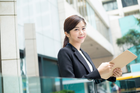 Asian business woman hold with clipboardの写真素材