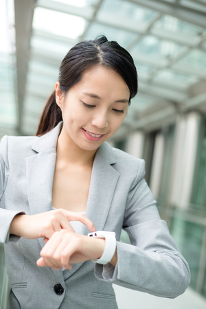 Business woman use of smart watchの写真素材