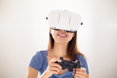 Woman play game on virtual reality deviceの写真素材