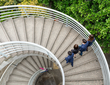 Top view of business people walking up to the staircaseの写真素材
