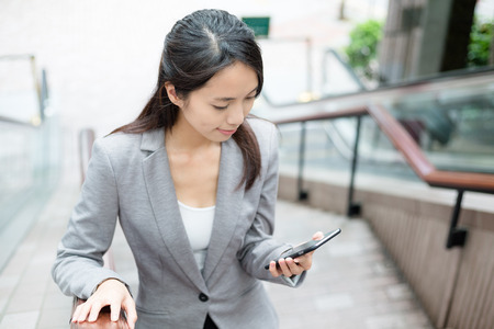Businesswoman with smartphoneの写真素材