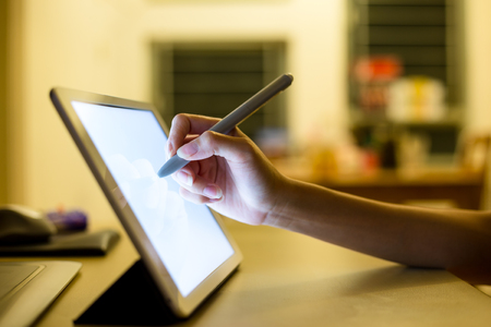 Woman use of tablet to designの写真素材