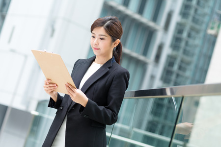 Business woman read on the documentの写真素材