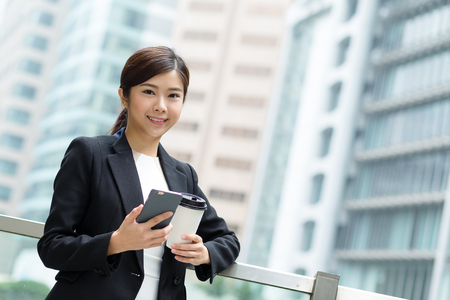 Businesswoman use of mobile phoneの写真素材