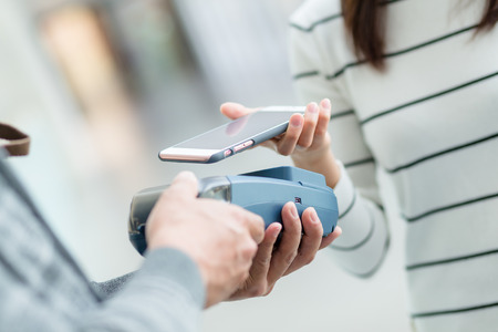 Customer pay with mobile phoneの写真素材