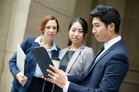 Business people discuss on tabletの写真素材
