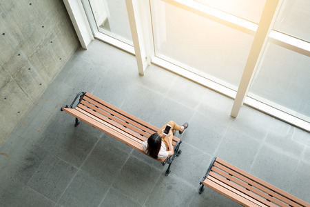 Top view of woman use of cellphoneの写真素材