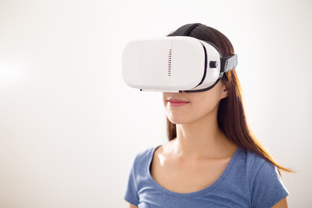 Woman wearing VR deviceの写真素材
