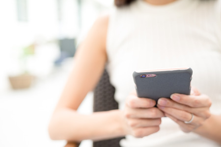 Woman browse internet on cellphoneの写真素材