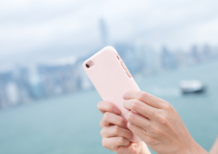 Woma send sms on smart phoneの写真素材