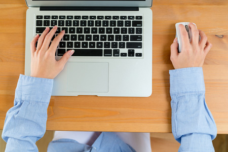 Top view of woman use of notebook computerの写真素材