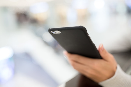 Woman browsing internet on cellphoneの写真素材