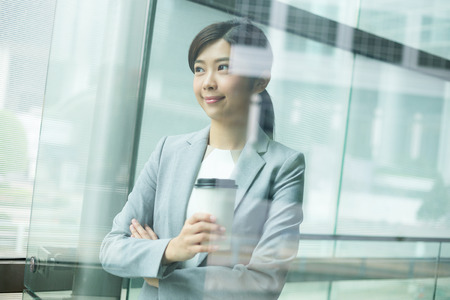 Asian businesswoman inside officeの写真素材